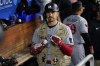 Minnesota Twins' Trevor Larnach, center, celebrates in the dugout after hitting a home run during the eighth inning of a baseball game against the Los Angeles Dodgers in Los Angeles, Monday, May 15, 2023. Byron Buxton and Jorge Polanco also scored. (AP Photo/Ashley Landis)