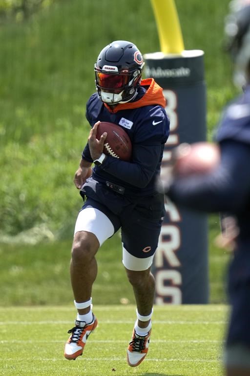 Chicago Bears wide receiver DJ Moore works on the field during NFL football OTA practice in Lake Forest, Ill., Tuesday, May 23, 2023. (AP Photo/Nam Y. Huh)