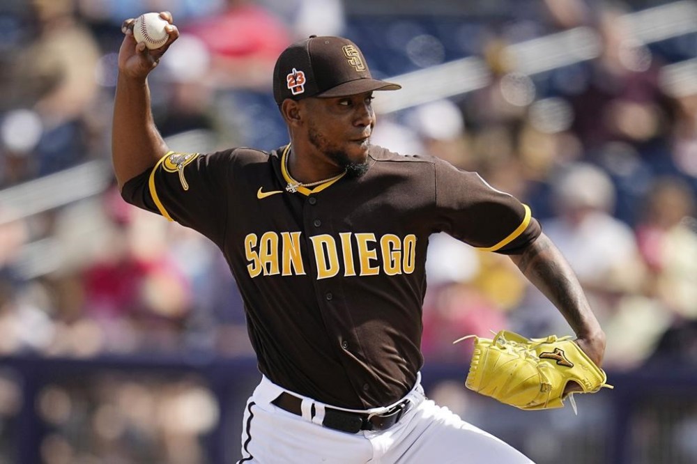 FILE - San Diego Padres relief pitcher Julio Teheran delivers during the fourth inning of a spring training baseball game against the Cincinnati Reds, Wednesday, March 8, 2023, in Peoria, Ariz. Two-time All-Star right-hander Julio Teheran, who hasn’t pitched in the major leagues since 2021, has agreed to terms on a deal with the Milwaukee Brewers. The move comes a day after Teheran opted out of a minor league deal with the Padres.(AP Photo/Abbie Parr, File)