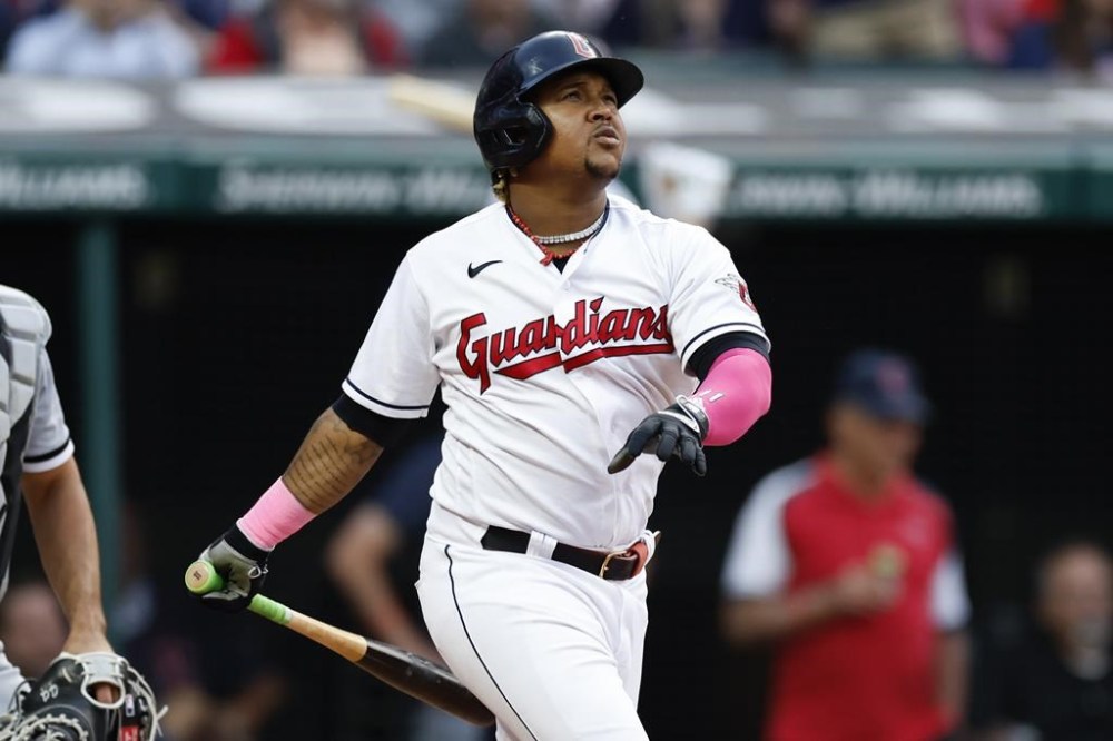 Cleveland Guardians' Jose Ramirez watches his triple off Chicago White Sox relief pitcher Joe Kelly during the eighth inning of a baseball game, Tuesday, May 23, 2023, in Cleveland. (AP Photo/Ron Schwane)