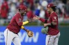 Arizona Diamondbacks' Geraldo Perdomo, left, and Ketel Marte celebrate after the Diamondbacks won a baseball game against the Philadelphia Phillies, Tuesday, May 23, 2023, in Philadelphia. (AP Photo/Matt Slocum)