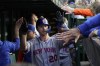 New York Mets' Pete Alonso is congratulated in the dugout after his home run off Chicago Cubs starting pitcher Drew Smyly during the fourth inning of a baseball game Tuesday, May 23, 2023, in Chicago. (AP Photo/Charles Rex Arbogast)