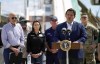 President Joe Biden listens as Florida Gov. Ron DeSantis speaks after they toured an area impacted by Hurricane Ian on Wednesday, Oct. 5, 2022, in Fort Myers Beach, Fla. (AP Photo/Evan Vucci)