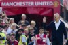 Manchester United's head coach Erik ten Hag waves to fans prior the English Premier League soccer match between Manchester United and Wolverhampton at the Old Trafford stadium in Manchester, England, Saturday, May 13, 2023. (AP Photo/Jon Super)