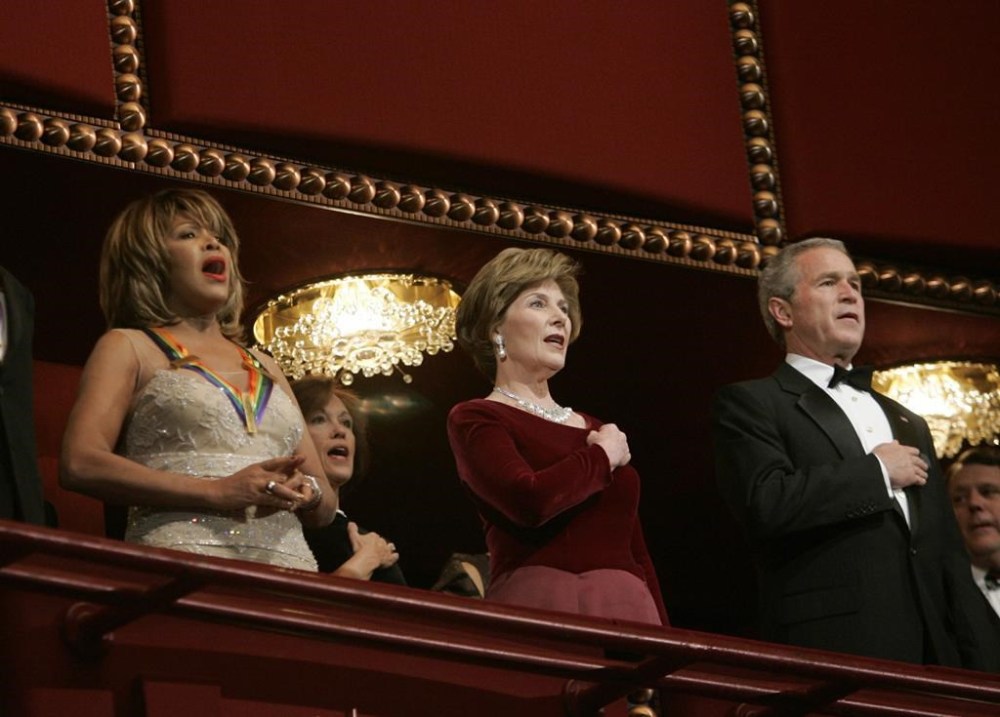 FILE - President Bush, right, and first lady Laura Bush, center, stand with singer Tina Turner at the Kennedy Center Honors Gala on Dec. 4, 2005 in Washington. Turner, the unstoppable singer and stage performer, died Tuesday, after a long illness at her home in Küsnacht near Zurich, Switzerland, according to her manager. She was 83. (AP Photo/Evan Vucci, File)