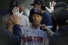 Boston Red Sox designated hitter Masataka Yoshida (7) celebrates in the dugout after scoring off of a double hit by Enrique Hernandez during the fourth inning of a baseball game against the Los Angeles Angels in Anaheim, Calif., Wednesday, May 24, 2023. (AP Photo/Ashley Landis)
