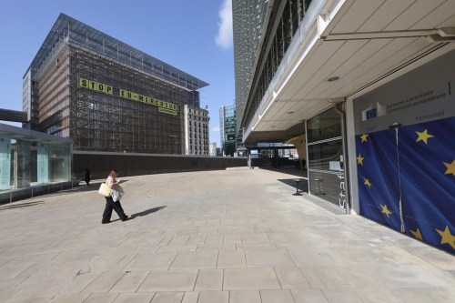 A banner, place by activist group Greenpeace, hangs on the facade of the European Council building, outside of a meeting of EU trade ministers, in Brussels, Thursday, May 25, 2023. The European Union Trade Ministers meet in Brussels Thursday to discuss, among other issues, the state of play of the trade relations with the United States and recent developments in EU-China trade relations. (AP Photo/Geert Vanden Wijngaert)