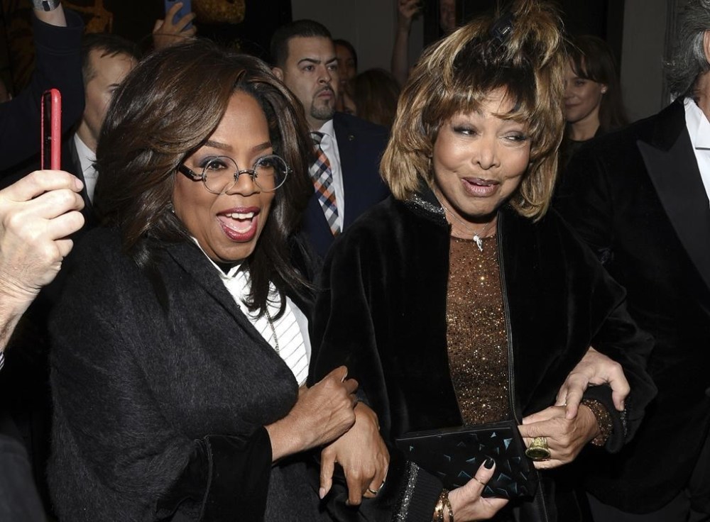 FILE - Singer Tina Turner, right, arrives with Oprah Winfrey for the opening night of