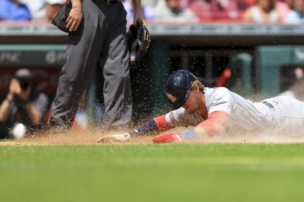 St. Louis Cardinals' Nolan Gorman scores a run on a wild pitch by Cincinnati Reds' Lucas Sims during the eighth inning of a baseball game in Cincinnati, Thursday, May 25, 2023. (AP Photo/Aaron Doster)