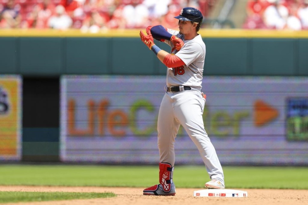 St. Louis Cardinals' Nolan Gorman gestures to teammates in the dugout after hitting an RBI-double during the eighth inning of a baseball game against the Cincinnati Reds in Cincinnati, Thursday, May 25, 2023. (AP Photo/Aaron Doster)