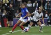 FILE - France's Delphine Cascarino, left, duels for the ball with Germany's Giulia Gwinn during the Women Euro 2022 semi final soccer match between Germany and France at MK stadium in Milton Keynes, England, Wednesday, July 27, 2022. The French winger will miss the Women's World Cup this summer after rupturing her right ACL playing for Lyon. (AP Photo/Rui Vieira, File)