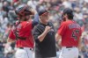 FILE - Cleveland Guardians' Cam Gallagher, left, pitching coach Carl Willis, center, and starting pitcher Cal Quantrill, right, have a mound meeting during the fourth inning of a baseball game against the Chicago White Sox in Cleveland, Wednesday, May 24, 2023. One of baseball's best stories last season, the Guardians have fallen on hard times with troubling signs that a recovery might not be forthcoming. (AP Photo/Phil Long, File)