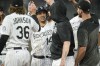 Colorado Rockies' Ezequiel Tovar, second from left, is congratulated by teammates after his single drove in the winning run against Miami Marlins relief pitcher Huascar Brazoban during the ninth inning of a baseball game Thursday, May 25, 2023, in Denver. (AP Photo/David Zalubowski)