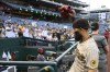 San Diego Padres' Rougned Odor raises his glove to the crowd after the team's 8-6 win over the Washington Nationals in a baseball game Thursday, May 25, 2023, in Washington. (AP Photo/Nick Wass)