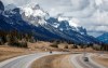Traffic travels along the Trans Canada Highway past Mount Rundle of the Rocky Mountains near Canmore, Alta., on April 24, 2023. THE CANADIAN PRESS/Jeff McIntosh