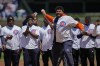 New Chicago Bears rookie Darnell Wright throws out a ceremonial first pitch before a baseball game between the Chicago Cubs and Cincinnati Reds Friday, May 26, 2023, in Chicago. (AP Photo/Erin Hooley)