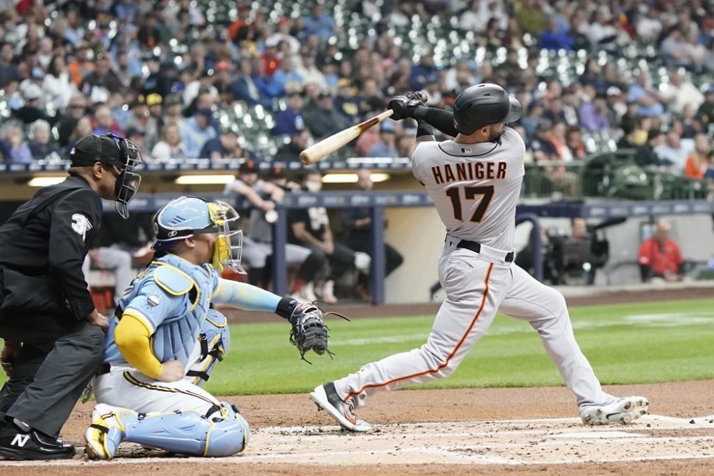 San Francisco Giants' Mitch Haniger hits a two-run home run during the second inning of a baseball game against the Milwaukee Brewers Friday, May 26, 2023, in Milwaukee. (AP Photo/Morry Gash)