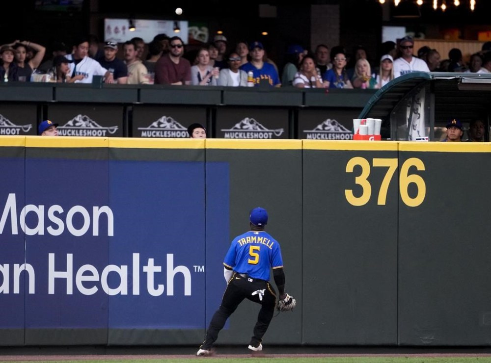 Seattle Mariners left fielder Taylor Trammell watches a ground-rule double by Pittsburgh Pirates' Tucupita Marcano during the second inning of a baseball game Friday, May 26, 2023, in Seattle. (AP Photo/Lindsey Wasson)