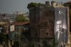 A giant banner of Turkish President and People's Alliance's presidential candidate Recep Tayyip Erdogan is displayed on an historical city wall, in Istanbul, Turkey, Saturday, April 22, 2023. Turkish President Recep Tayyip Erdogan is favored to win reelection in a presidential runoff Sunday, May 28, 2023, despite a host of domestic issues. (AP Photo/Emrah Gurel)