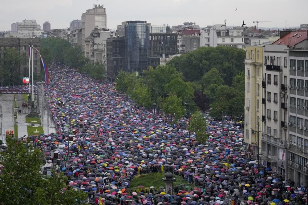 People attend an opposition-led protest demanding resignations of top officials and the revoking of licenses for pro-government media that air violent content and host crime figures and war criminals, in Belgrade, Serbia, Saturday, May 27, 2023. The protests in Belgrade and other Serbian cities are the biggest in years against Vucic and his government. They were organized in response to a pair of mass shootings earlier this month that left 18 people dead and 20 wounded, many of them children from an elementary school. (AP Photo/Darko Vojinovic)
