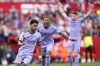 Real Madrid's Rodrygo, left, reacts after scoring his side's first goal during a Spanish La Liga soccer match between Sevilla and Real Madrid at the Ramon Sanchez Pizjuan stadium in Seville, Spain, Saturday, May 27, 2023. (AP Photo/Jose Breton)