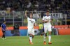 Atalanta's Mario Pasalic, left, celebrates after scoring to 2-1 during the Serie A soccer match between Inter Milan and Atalanta at the San Siro Stadium, in Milan, Italy, Saturday, May 27, 2023. (AP Photo/Antonio Calanni)