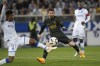 Auxere's Rayan Raveloson, left, challenges for the ball with PSG's Lionel Messi, centre, during the French League One soccer match between Auxerre and Paris Saint Germain, at the Abbe Deschamps stadium in Auxerre, central France, Sunday, May 21, 2023. (AP Photo/Thibault Camus)