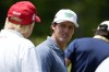 Former President Donald Trump talks with professional golfer Mito Pereira on the driving range before the second round of the LIV Golf at Trump National Golf Club, Saturday, May 27, 2023, in Sterling, Va. (AP Photo/Alex Brandon)