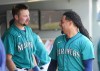 Seattle Mariners' Cal Raleigh, left, talks with starting pitcher Luis Castillo, right, after Castillo pitched through six innings against the Pittsburgh Pirates in a baseball game Saturday, May 27, 2023, in Seattle. (AP Photo/Lindsey Wasson)