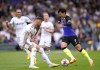 Tottenham Hotspur's Son Heung-min, right, and Leeds United's Liam Cooper battle for the ball during the English Premier League soccer match between Leeds United and Tottenham Hotspur at Elland Road, Leeds, England, Sunday May 28, 2023. (Tim Goode/PA via AP)