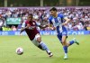 Aston Villa's Leon Bailey, left and Brighton's Julio Enciso vie for the ball, during the English Premier League soccer match between Aston Villa and Brighton & Hove, at Villa Park, in Birmingham, England, Sunday May 28, 2023. (Barrington Coombs/PA via AP)
