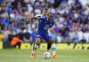 Newcastle United's Kieran Trippier, background and Chelsea's Raheem Sterling vie for the ball, during the English Premier League soccer match between Chelsea and Newcastle United, at Stamford Bridge, London, Sunday May 28, 2023. (Zac Goodwin/PA via AP)