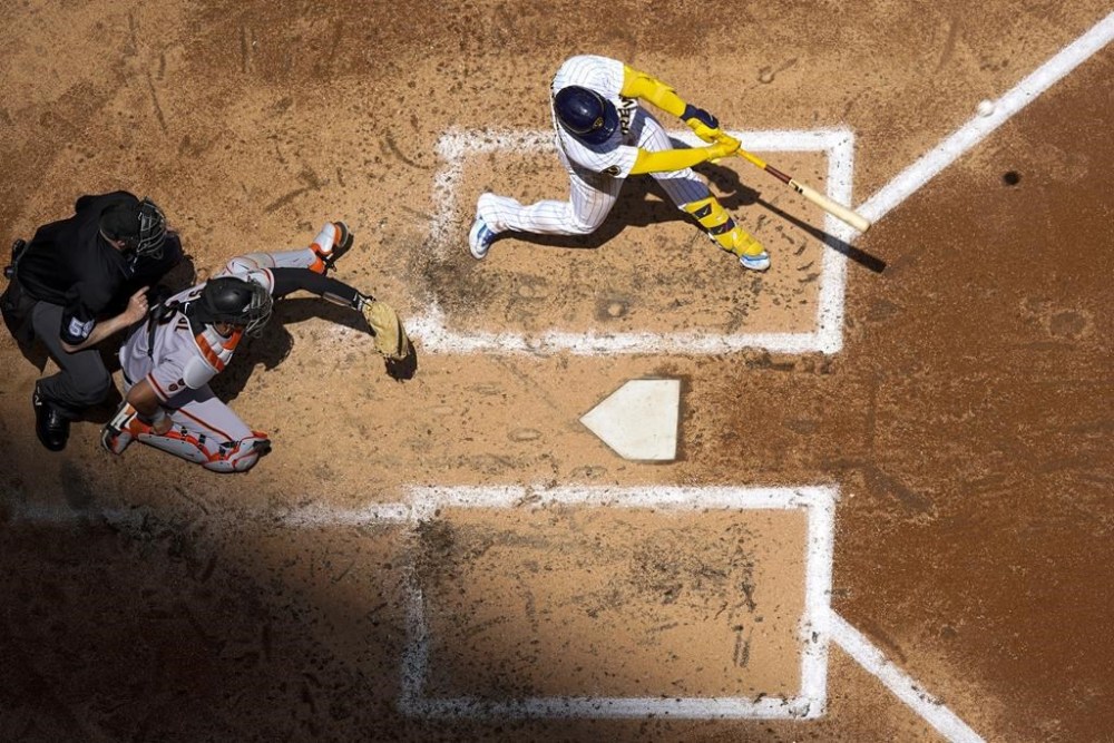 Milwaukee Brewers' William Contreras hits a two-run home run during the second inning of a baseball game against the San Francisco Giants Sunday, May 28, 2023, in Milwaukee. (AP Photo/Morry Gash)