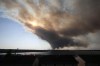 Thick plumes of heavy smoke fill the Halifax sky as an out-of-control fire in a suburban community quickly spread, engulfing multiple homes and forcing the evacuation of local residents on Sunday May 28, 2023. 
THE CANADIAN PRESS/Kelly Clark