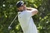 Captain Brooks Koepka, of Smash GC, hits from the 14th tee during the second round of LIV Golf DC at Trump National, Saturday, May 27, 2023, in Sterling, Va. (Hunter Martin/LIV Golf via AP)