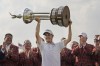 Emiliano Grillo, of Argentina, lifts the trophy after winning the Charles Schwab Challenge golf tournament at Colonial Country Club in Fort Worth, Texas, Sunday, May 28, 2023. (AP Photo/LM Otero)