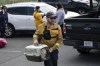 Patrick MacLennan with the Department of Natural Resources carries a cat rescued from the evacuated zone of the wildfire burning in Tantallon, N.S. outside of Halifax on Monday, May 29, 2023. THE CANADIAN PRESS/Darren Calabrese
