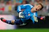 FILE - Former Manchester United goalkeeper Edwin van der Sar watches the ball as he saves on an attempt to score during his farewell tribute match at Amsterdam's ArenA stadium Wednesday Aug. 3, 2011. Edwin van der Sar is stepping down as director general of Ajax after the team finished a disappointing third in the Dutch Eredivisie, missing out on a Champions League berth for next season. (AP Photo/Peter Dejong, File)