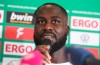 Marcus Coffie, player of the Teutonia Ottensen soccer club, speaks during a press conference in Hamburg, Germany, Thursday, Aug. 25, 2022. Hamburg-based Teutonia Ottensen says the North German Soccer Federation’s decision to punish the club for breaking off a game in protest against alleged racist abuse directed at team captain Marcus Coffie is “a slap in the face.” (Michael Schwartz/dpa via AP)