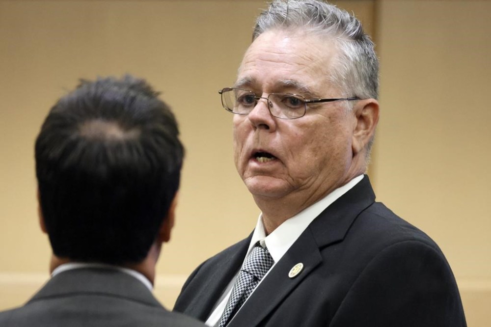 Former Marjory Stoneman Douglas High School School Resource Officer Scot Peterson speaks with his defense lawyer Mark Eiglarsh during a hearing at the Broward County Courthouse in Fort Lauderdale, Fla., on Tuesday, May 30, 2023. Peterson is about to be tried on charges he failed to confront the gunman who murdered 14 students and three staff members at a Parkland high school five years ago. (Amy Beth Bennett/South Florida Sun-Sentinel via AP, Pool)