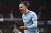 FILE - Manchester City's Jack Grealish celebrates after scoring his side's first goal during the English Premier League soccer match between Manchester United and Manchester City at Old Trafford in Manchester, England, Saturday, Jan. 14, 2023. Grealish has emerged as the face of English soccer and is starting to add trophies to his growing list of endorsement deals that already include Gucci and PUMA. The Manchester City midfielder has the skill and playfulness of Paul Gascoigne and the boyish charm and marketability of David Beckham. (AP Photo/Dave Thompson, File)