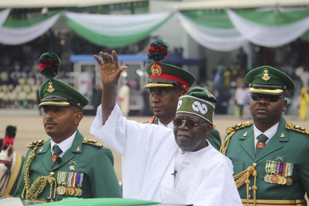 Nigeria's new President Bola Ahmed Tinubu, inspects honour guards after taking an oath of office at a ceremony in Abuja Nigeria, Monday May 29, 2023. A year after arguing Nigeria's ruling party is responsible for terrorist acts, the Trudeau government has sent a cabinet minister to celebrate its presidential visit THE CANADIAN PRESS/AP-Olamikan Gbemiga