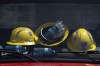 Firefighters' helmets and water bottles rest against the windshield of a truck at a command centre within the evacuated zone of the wildfire burning in Tantallon, N.S., outside of Halifax on Wednesday, May 31, 2023. THE CANADIAN PRESS/Darren Calabrese