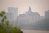 The Delta Hotels Bessborough is photographed through thick smoke from wildfires burning across the Prairies, in Saskatoon, Sask., on Saturday, May 20, 2023. The Saskatchewan Public Safety Agency says it may need extra help to fight fires in the province’s northern region. THE CANADIAN PRESS/Heywood Yu