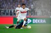 Stuttgart's Enzo Millot, top, and Hamburg's Ludovit Reis in action during the first leg of the German Bundesliga relegation soccer match between Stuttgart and Hamburger at the Mercedes-Benz Arena in Stuttgart, Germany, Thursday, June 1, 2023. (Tom Weller/dpa via AP)