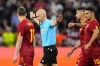 Referee Anthony Taylor signals no penalty for Sevilla after checking the VAR during the Europa League final soccer match between Sevilla and Roma, at the Puskas Arena in Budapest, Hungary, Wednesday, May 31, 2023. (AP Photo/Petr David Josek)