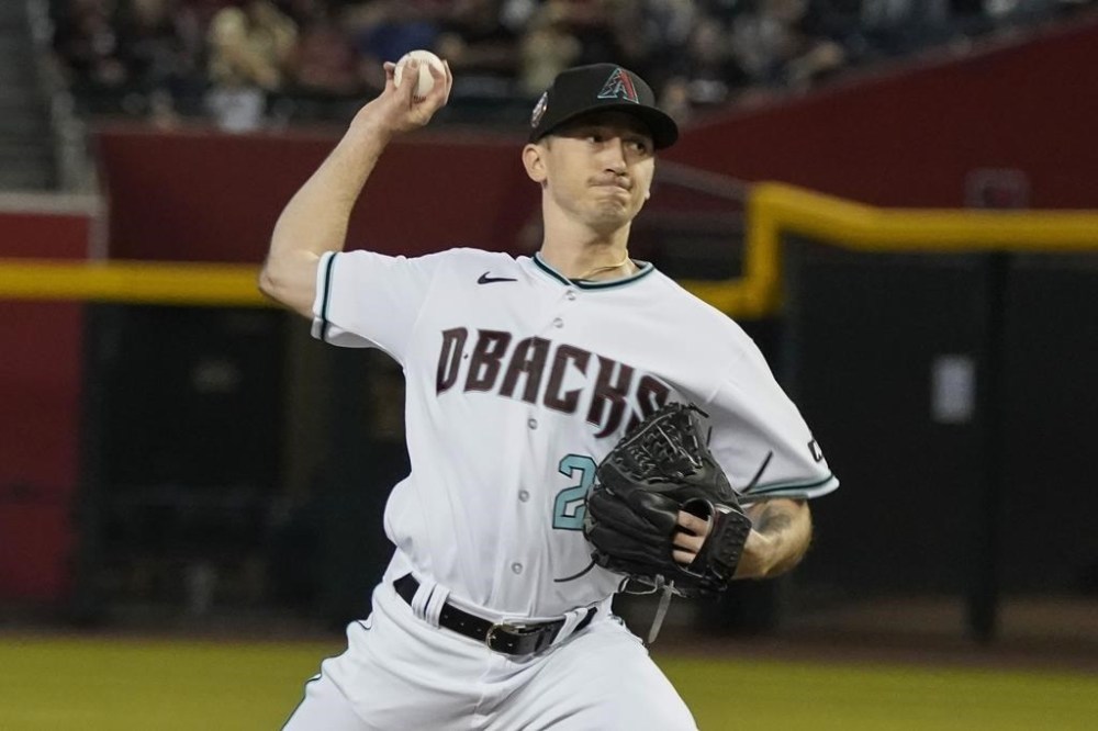 Arizona Diamondbacks staring pitcher Zach Davies throws against the Colorado Rockies during the first inning of a baseball game Thursday, June 1, 2023, in Phoenix. (AP Photo/Darryl Webb)