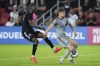 CF Montreal defender Gabriele Corbo, right, blocks a kick by D.C. United forward Christian Benteke during the second half of an MLS soccer match in Washington, Wednesday, May 31, 2023. THE CANADIAN PRESS/AP-Manuel Balce Ceneta