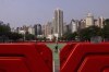 A worker sprays water on Victoria Park in Hong Kong, as government closed parts of traditional venue of the city's annual Tiananmen crackdown vigil for 