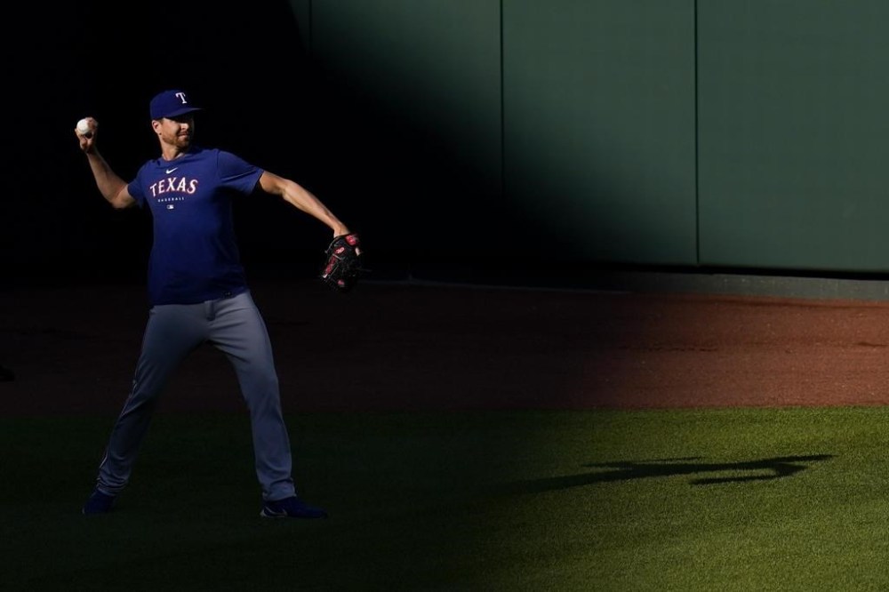 Texas Rangers pitcher Jacob deGrom works out prior to a baseball game against the Baltimore Orioles, Friday, May 26, 2023, in Baltimore. (AP Photo/Julio Cortez)